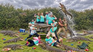 Harland Accountants’ AI-enhanced wacky photo competition entry featuring the team surrounded by crocodiles